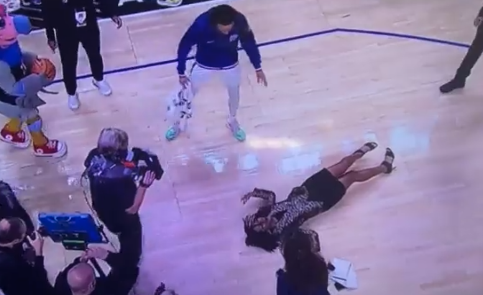 Sports Reporter Kristina Pink Takes Nasty Fall After Water Is Poured On ...