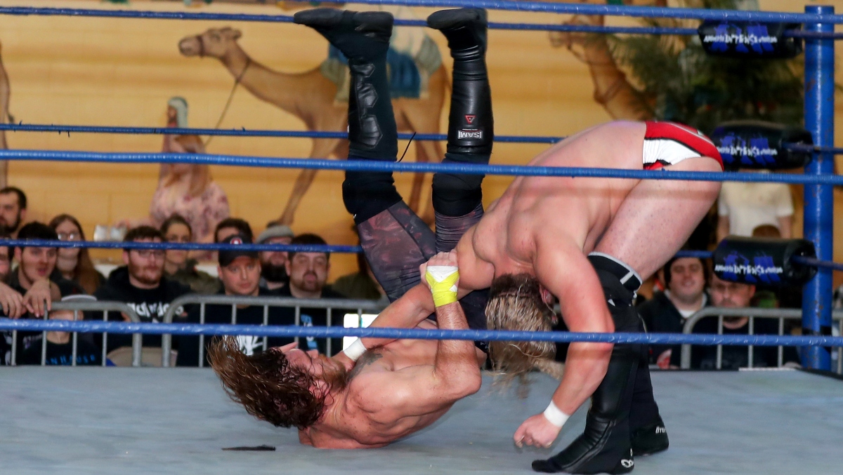 Couple Chokeslam A Guy Through A Table In The Middle Of Their Wedding