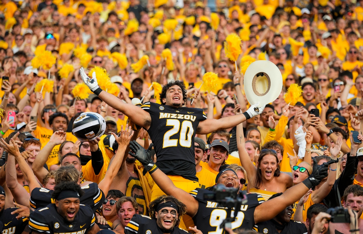 Missouri Fan Kicks Football at Kansas Sideline in Border War Game
